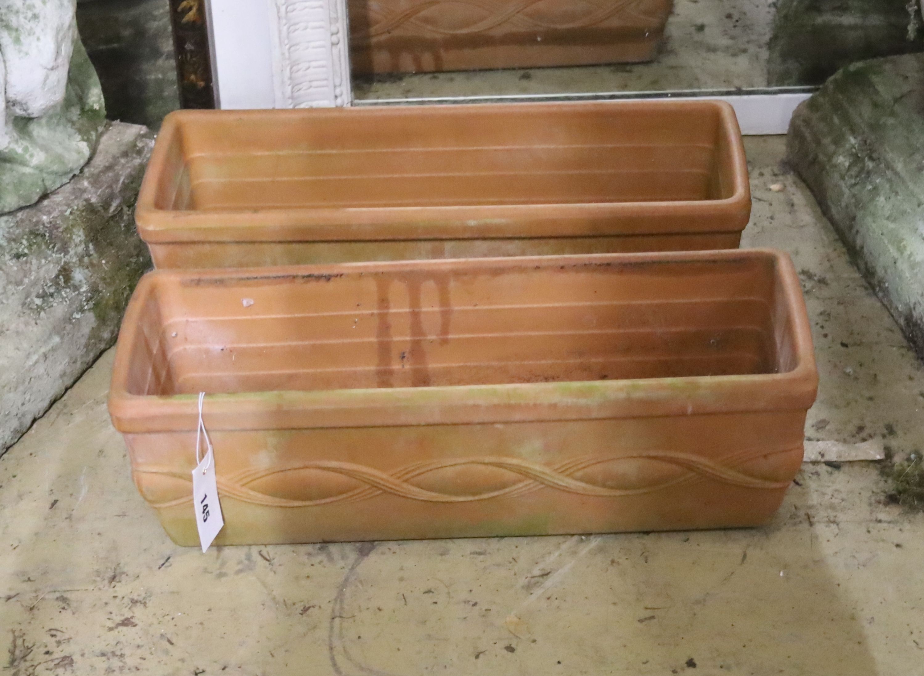 A pair of small rectangular terracotta garden planters, width 50cm, depth 18cm, height 15cm